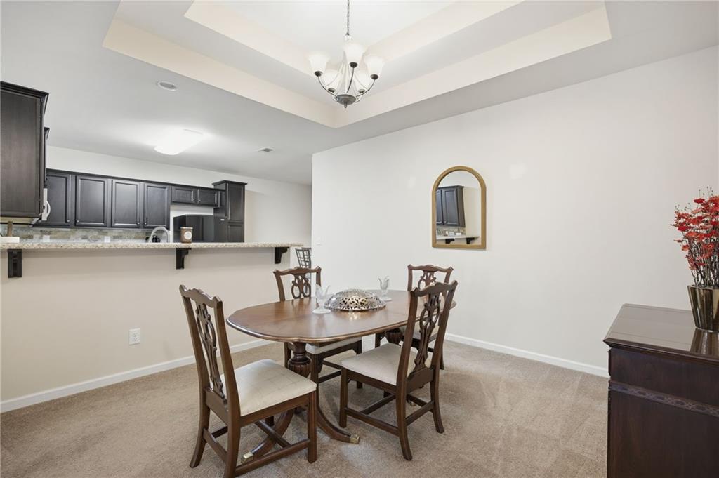 2403 Tree Arbor Way Marietta, GA 30064 - Photo 15 of 25 a view of a dining room with furniture and wooden floor