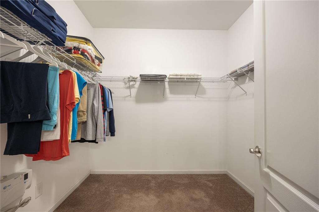 2403 Tree Arbor Way Marietta, GA 30064 - Photo 18 of 25 a view of walk in closet with clothes