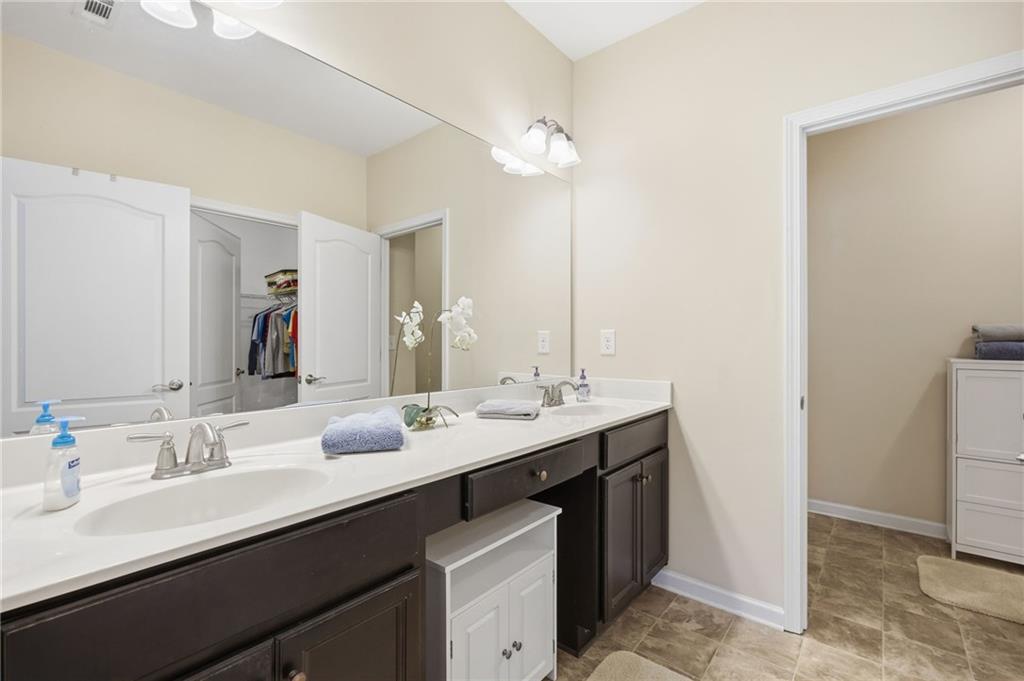 2403 Tree Arbor Way Marietta, GA 30064 - Photo 19 of 25 a bathroom with a double vanity sink and a mirror