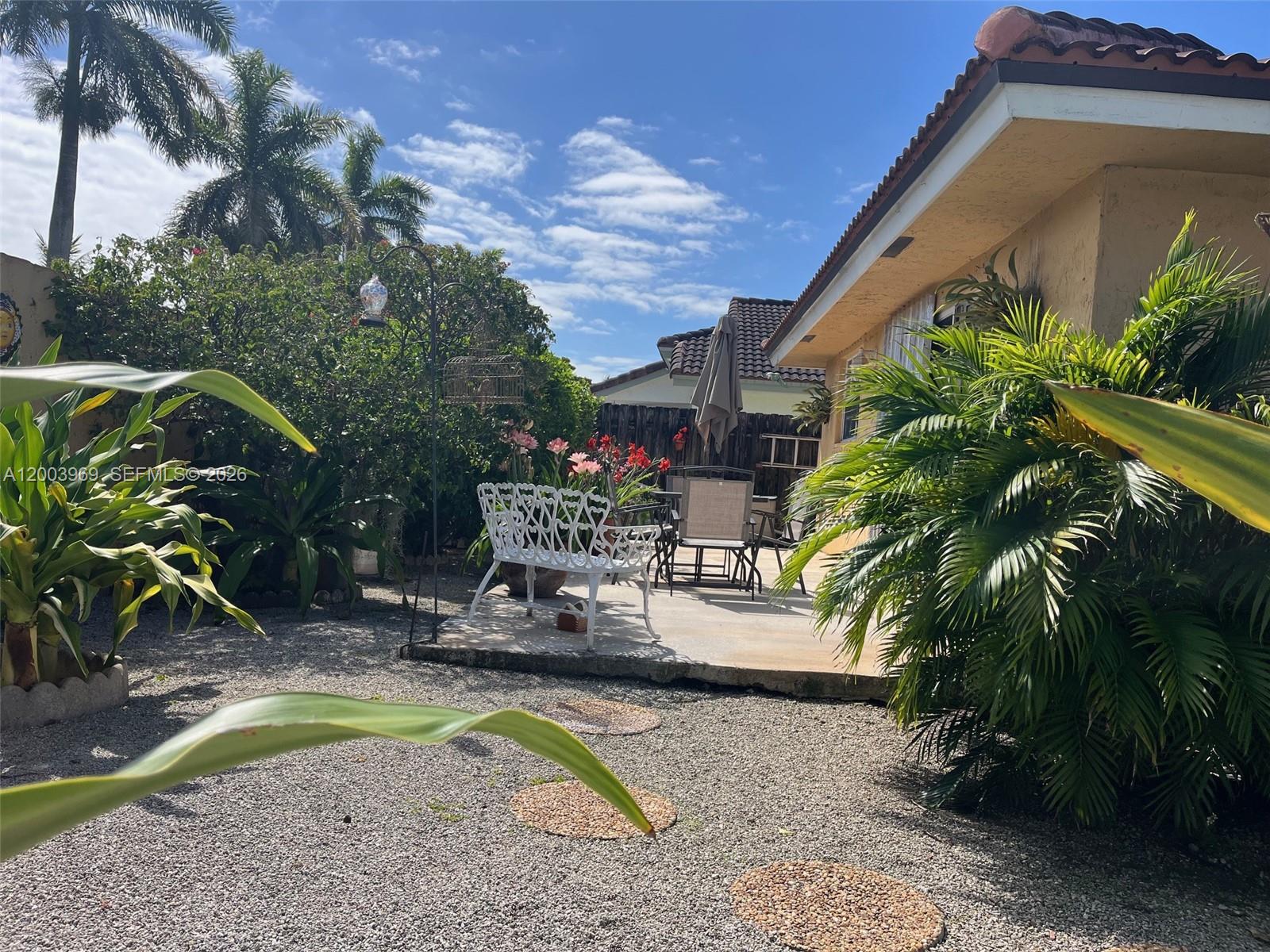 6061 Southwest 128th Court Miami, FL 33183 - Photo 16 of 16 a view of backyard with swimming pool and outdoor seating