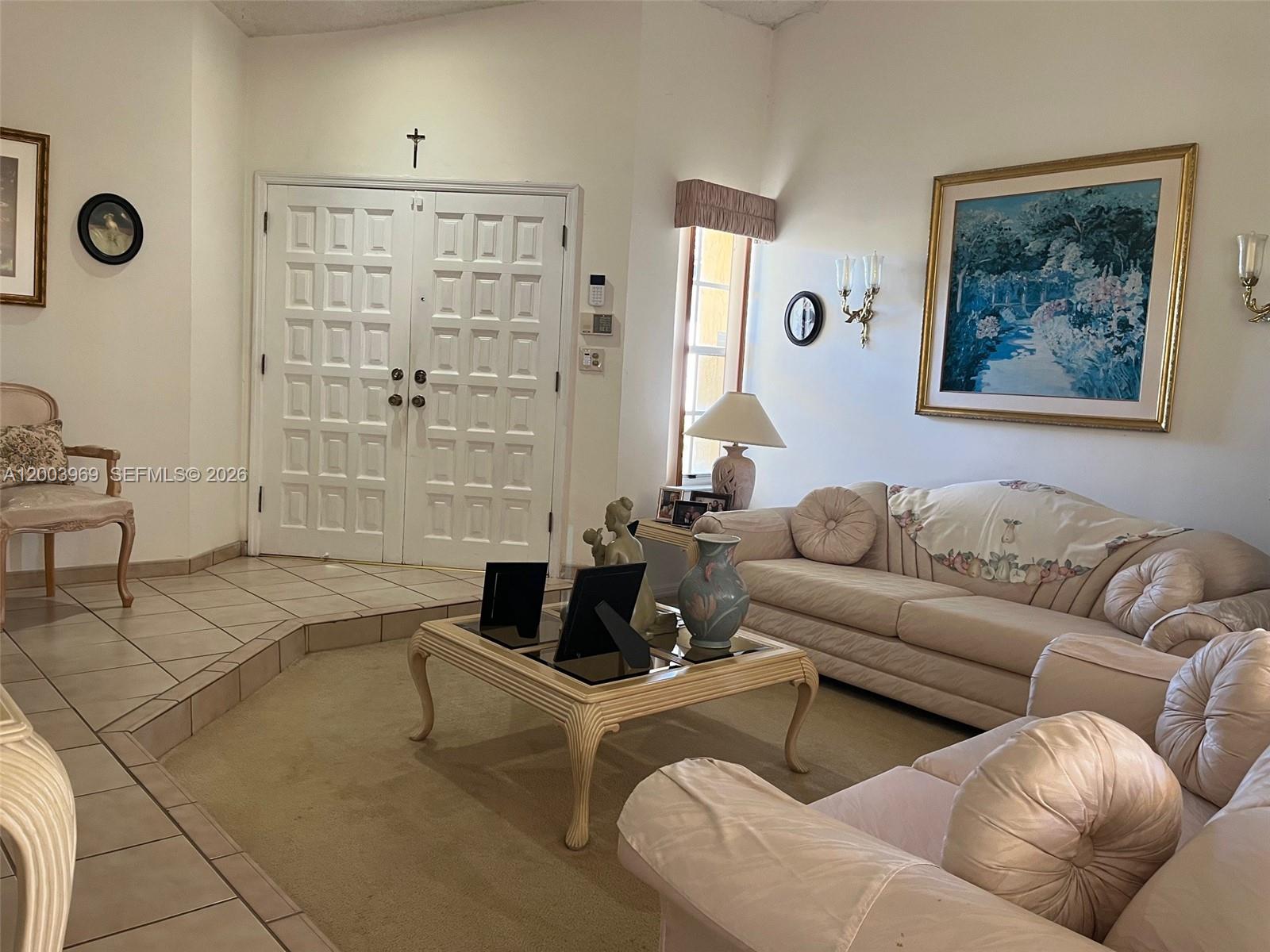 6061 Southwest 128th Court Miami, FL 33183 - Photo 4 of 16 a living room with furniture and a large window