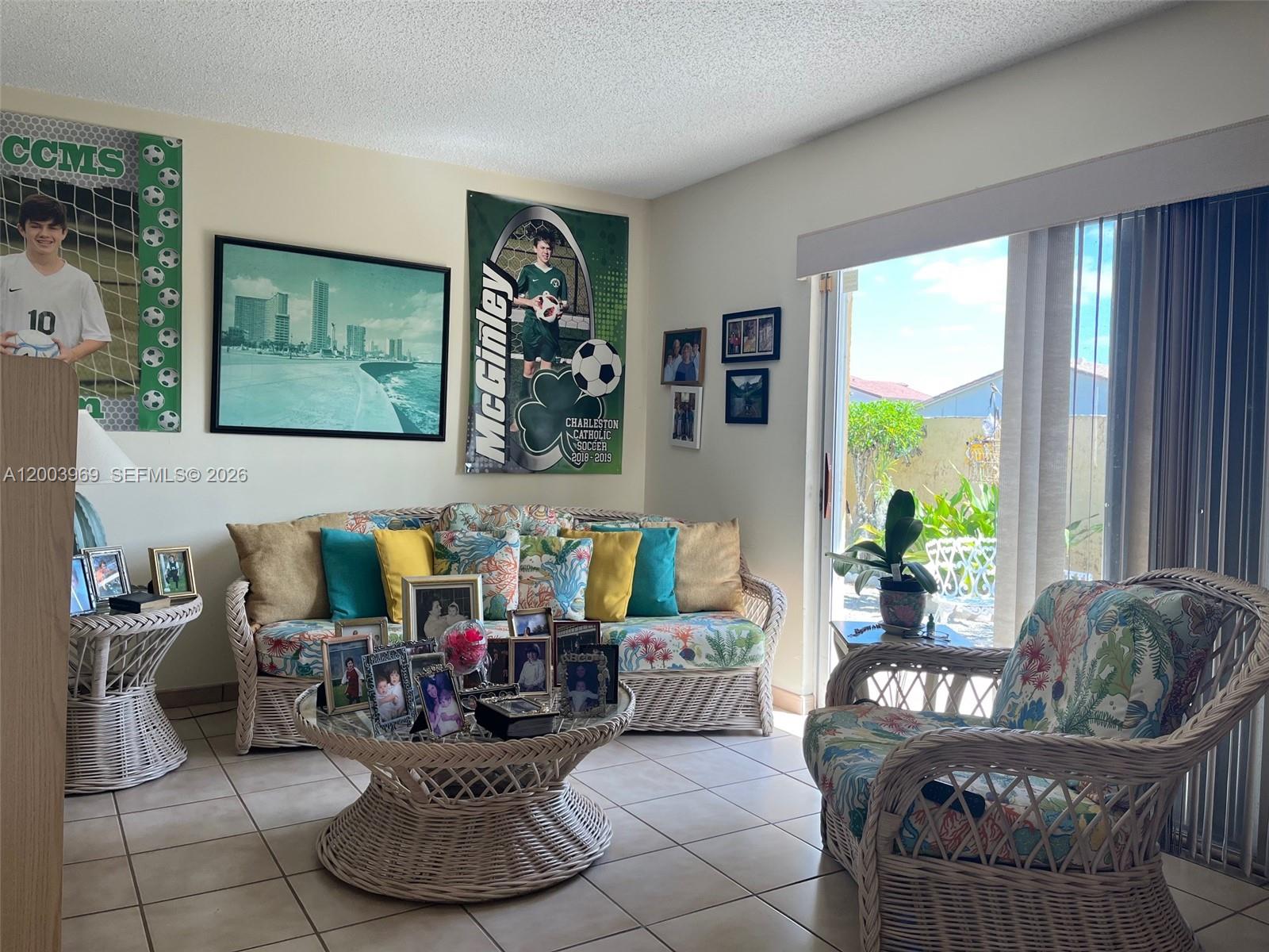 6061 Southwest 128th Court Miami, FL 33183 - Photo 7 of 16 a living room with furniture and a large window