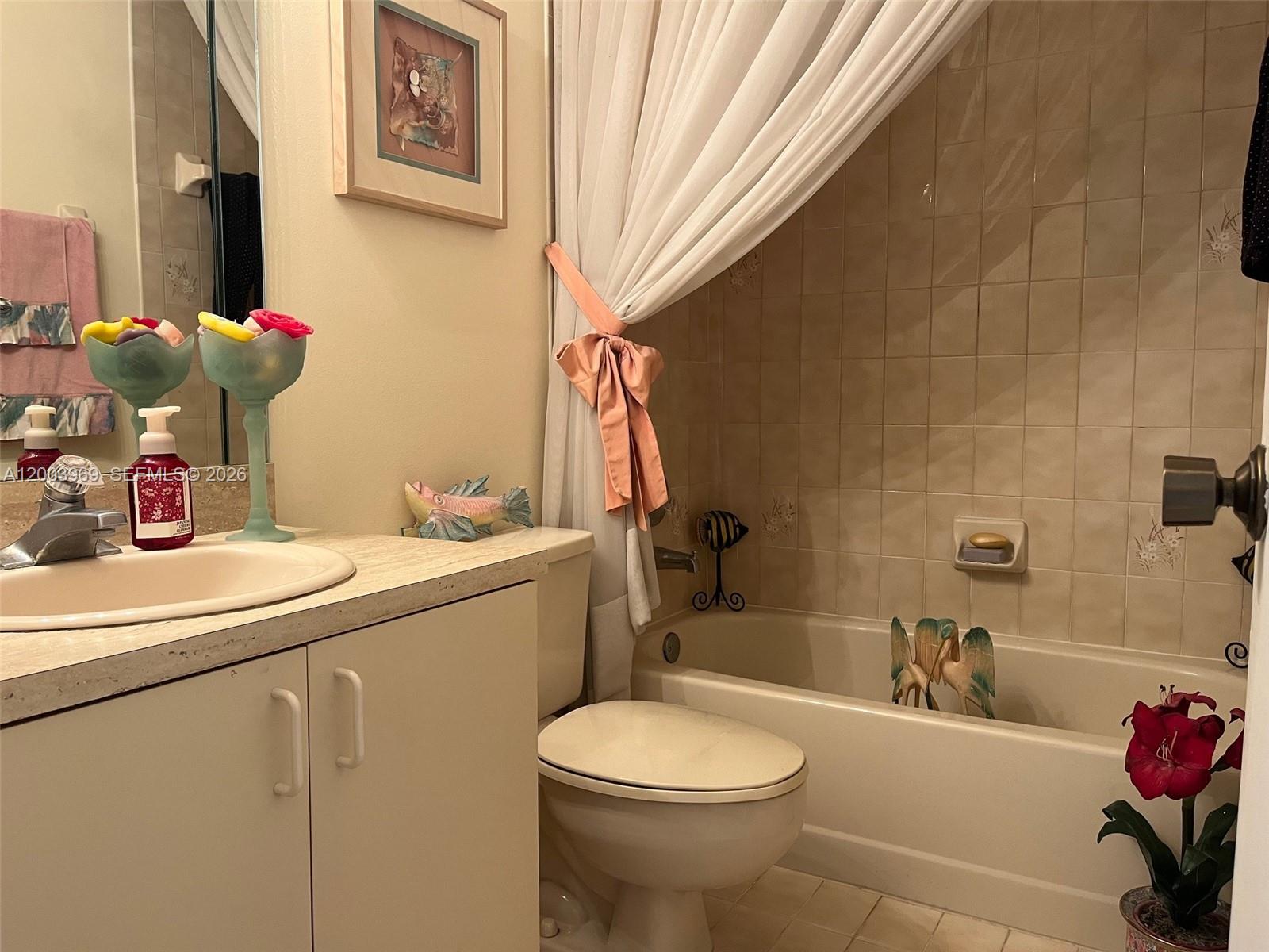 6061 Southwest 128th Court Miami, FL 33183 - Photo 9 of 16 a bathroom with a sink toilet and tub