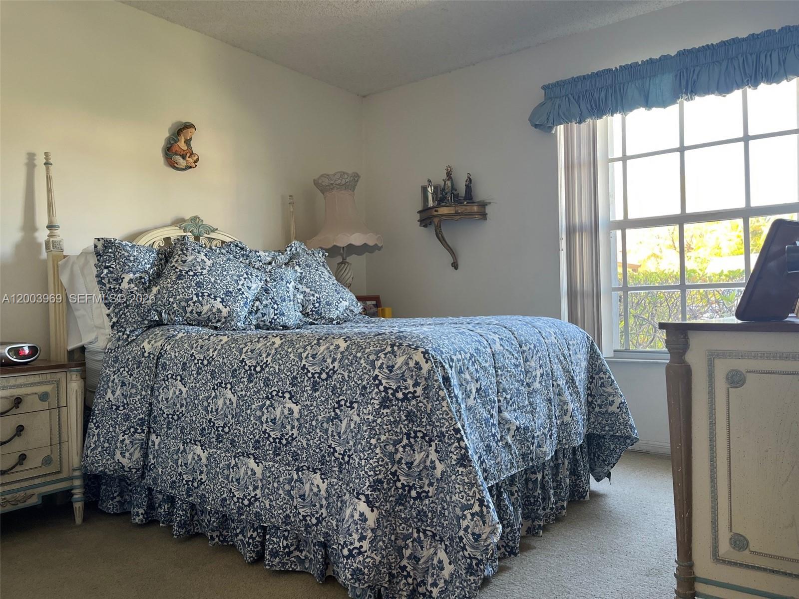 6061 Southwest 128th Court Miami, FL 33183 - Photo 10 of 16 a bedroom with a bed and a window