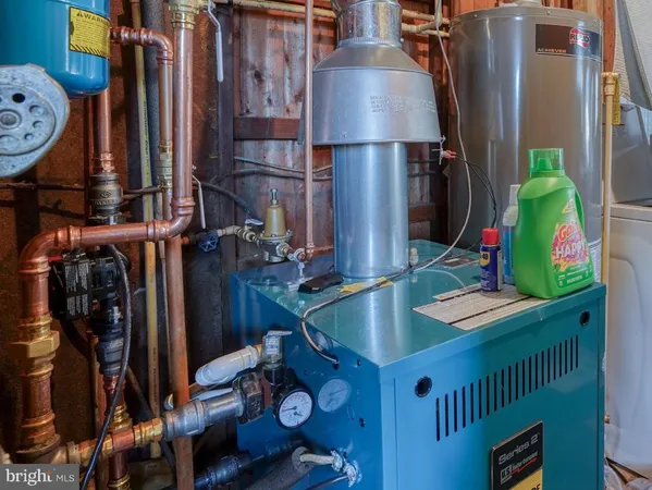 a kitchen with a refrigerator and a stove