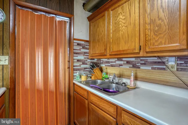 a kitchen with a sink and cabinets
