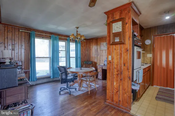 a view of a livingroom with furniture and hardwood floor