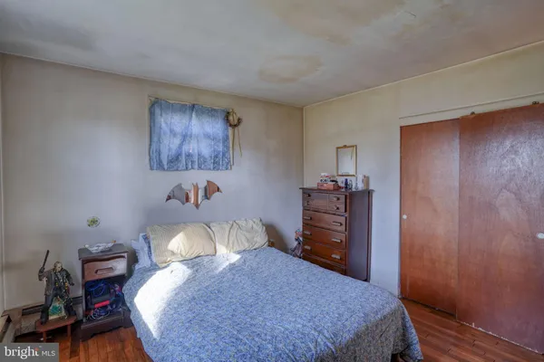a bedroom with a bed and a closet