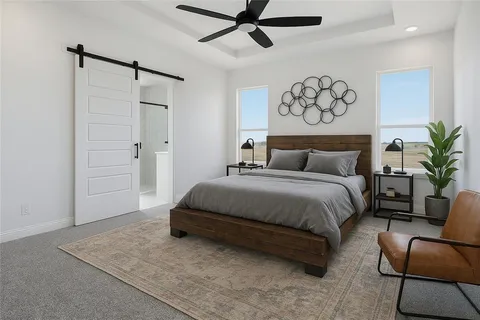 a bedroom with a bed and a couch