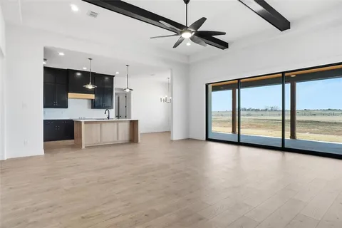 a view of a livingroom with kitchen