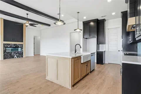 a kitchen with stainless steel appliances a stove oven and a refrigerator