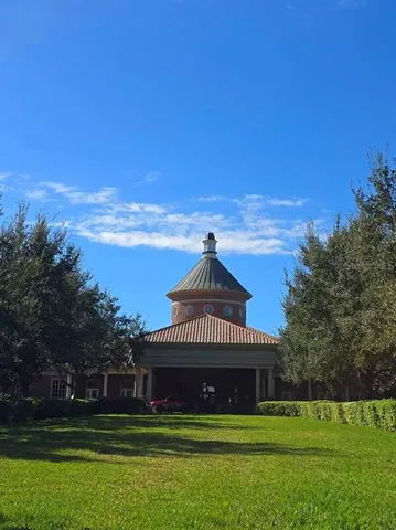 a view of a swimming pool with outdoor seating