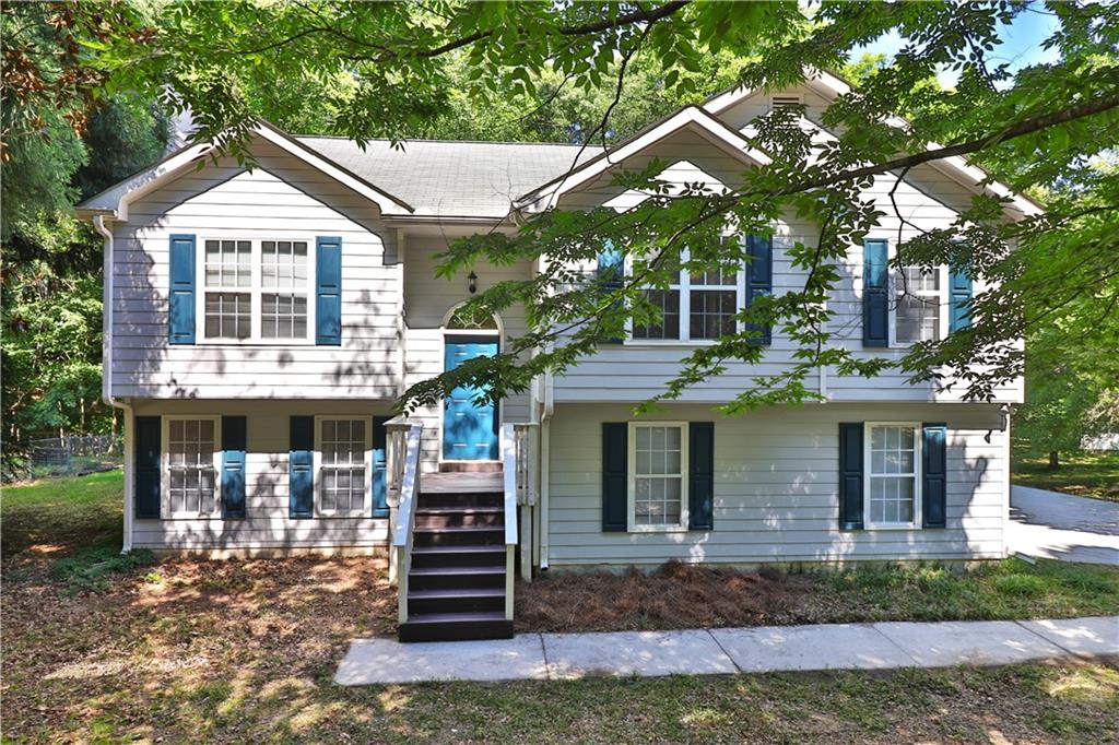353 Fall View Court Winder, GA 30680 - Photo 2 of 61 a front view of a house with garden
