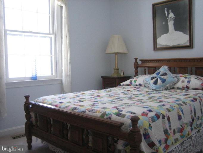 6542 Little Ox Road Fairfax Station, VA 22039 - Photo 12 of 30 a bedroom with a bed and a window