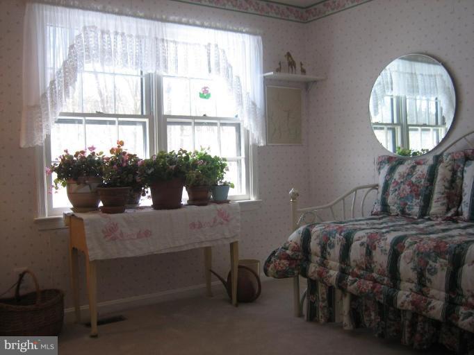 6542 Little Ox Road Fairfax Station, VA 22039 - Photo 13 of 30 a bedroom with bed and a large window