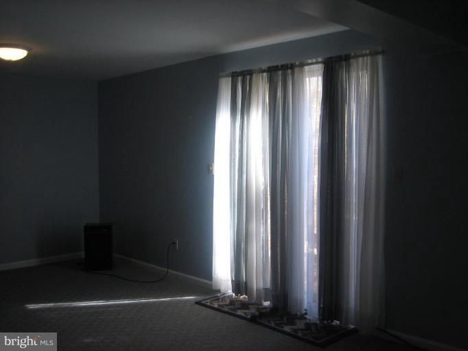 6542 Little Ox Road Fairfax Station, VA 22039 - Photo 21 of 30 an empty room with windows