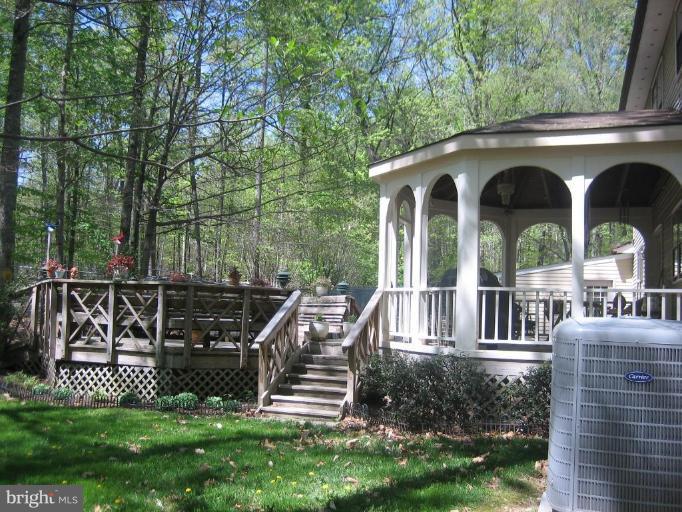 6542 Little Ox Road Fairfax Station, VA 22039 - Photo 27 of 30 a view of front of a house with a yard