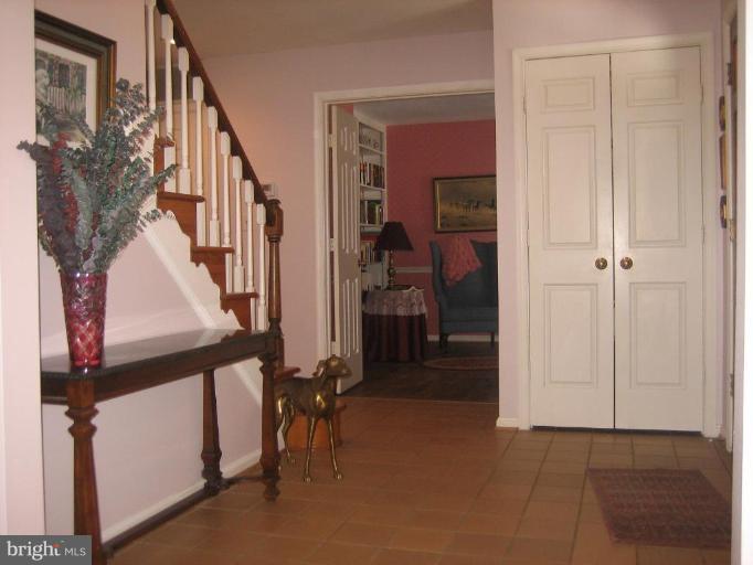 6542 Little Ox Road Fairfax Station, VA 22039 - Photo 4 of 30 a view of an entryway with a flower pot