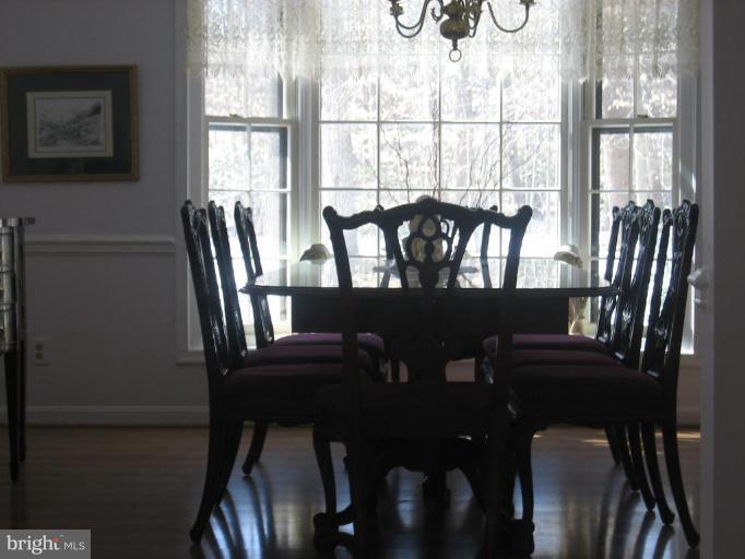 6542 Little Ox Road Fairfax Station, VA 22039 - Photo 6 of 30 a view of a dining room with furniture window and outside view