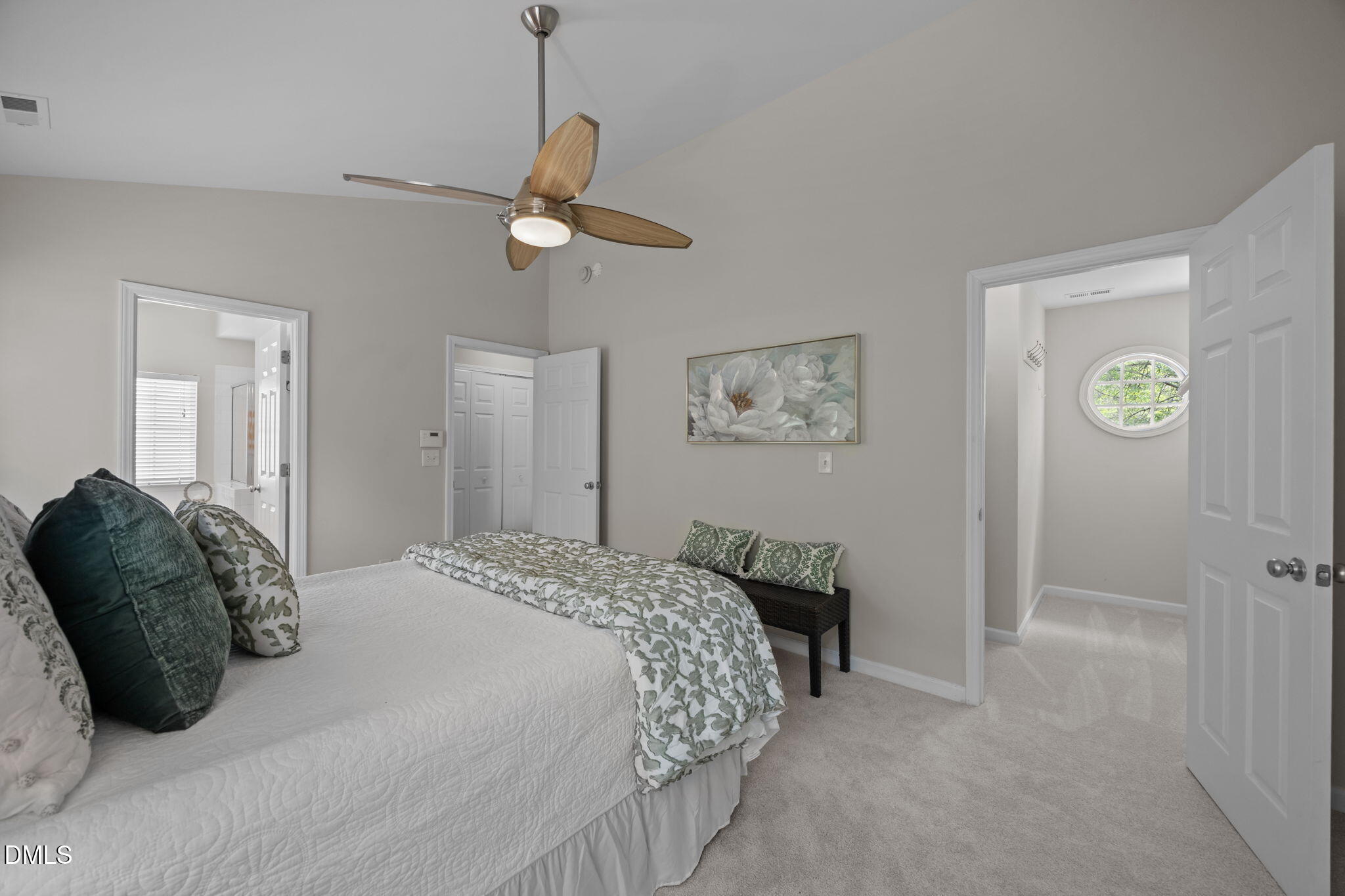 1003 Red Hat Lane Durham, NC 27713 - Photo 39 of 60 a bedroom with a bed and a chandelier