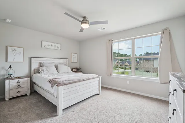 a bed room with a bed and a window