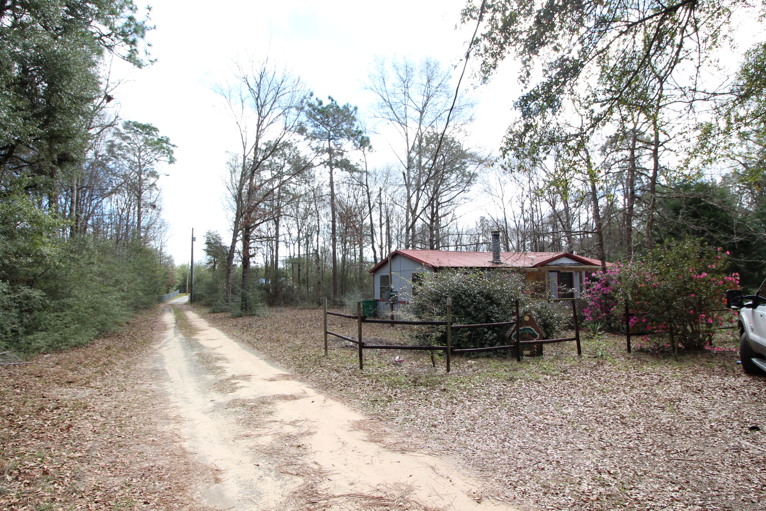 6063 Dairy Road Baker, FL 32531 - Photo 8 of 8 a backyard of a house with lots of green space
