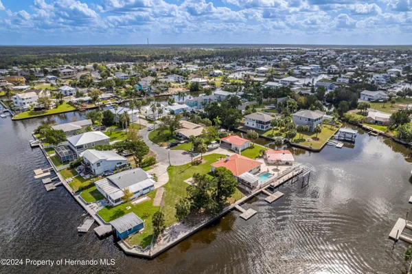 an aerial view of a house with a ocean view