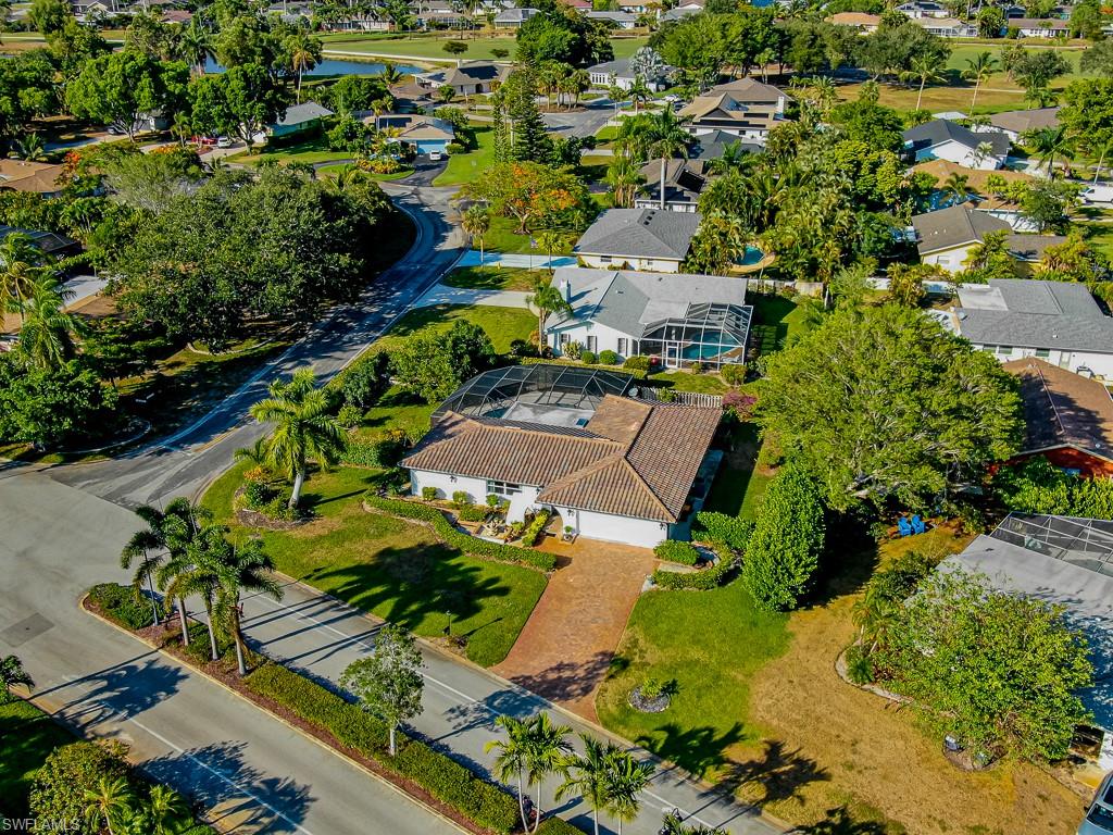 67 Pebble Beach Boulevard Naples, FL 34113 - Photo 26 of 28 Bird's eye view featuring a residential view
