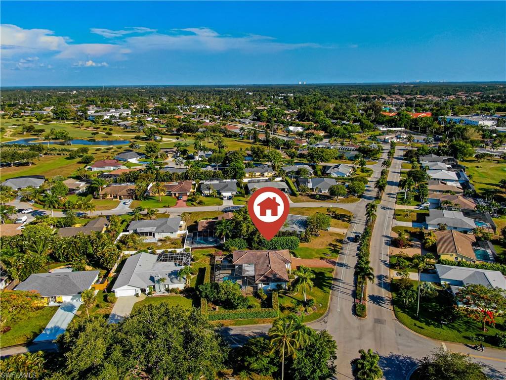 67 Pebble Beach Boulevard Naples, FL 34113 - Photo 28 of 28 Drone / aerial view with a water view and a residential view