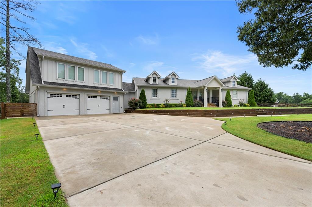 587 Hoyt King Road Bethlehem, GA 30620 - Photo 1 of 1 a front view of a house with garden