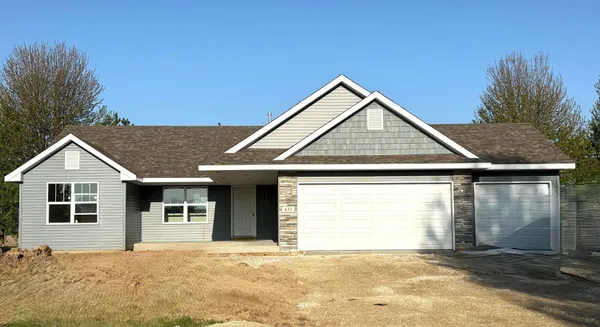 a front view of a house with a garage