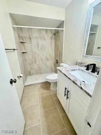 a view of hallway with large windows