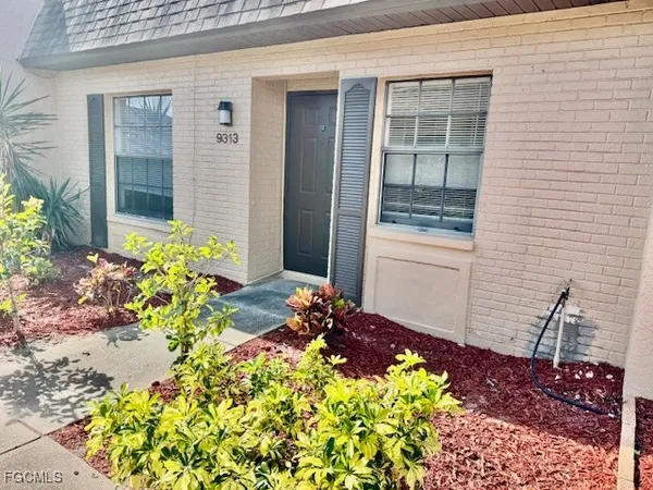 a kitchen with a sink a stove and a refrigerator