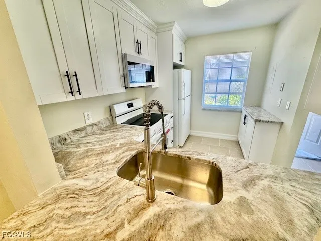 a view of room with kitchen island and natural light