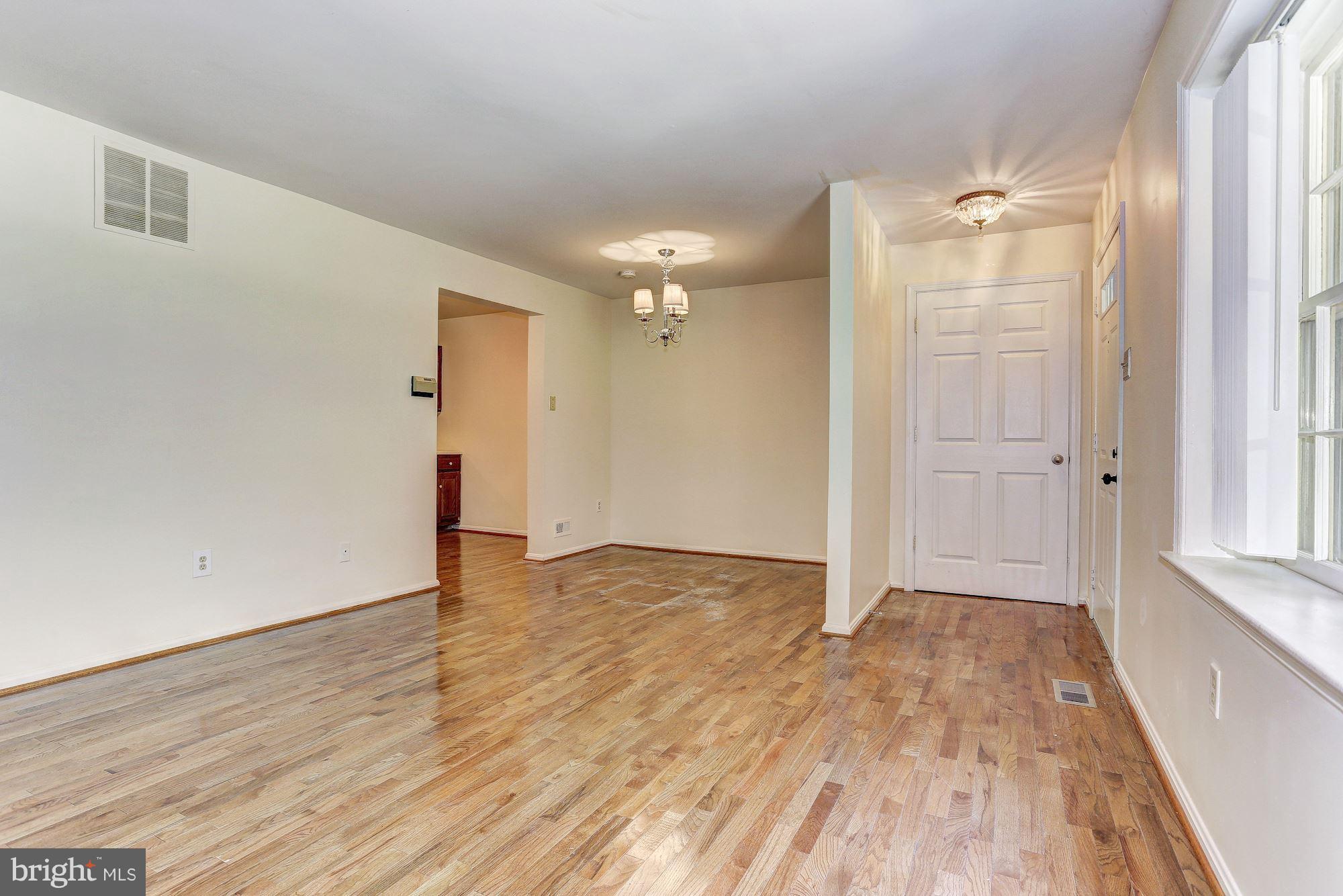 9776 Whiskey Run Laurel, MD 20723 - Photo 4 of 15 wooden floor in an empty room with a window