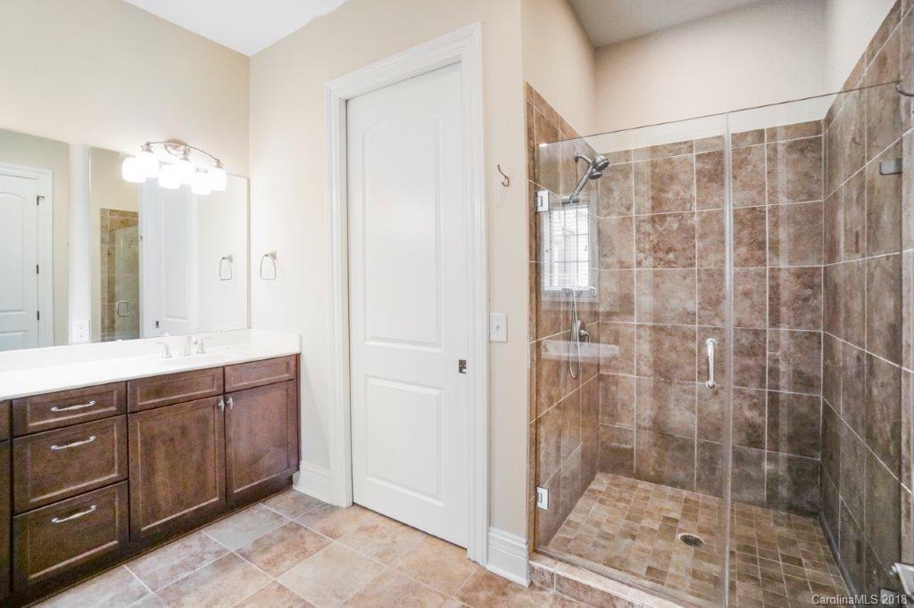 3272 Park Road Charlotte, NC 28209 - Photo 17 of 31 a bathroom with a shower and a sink