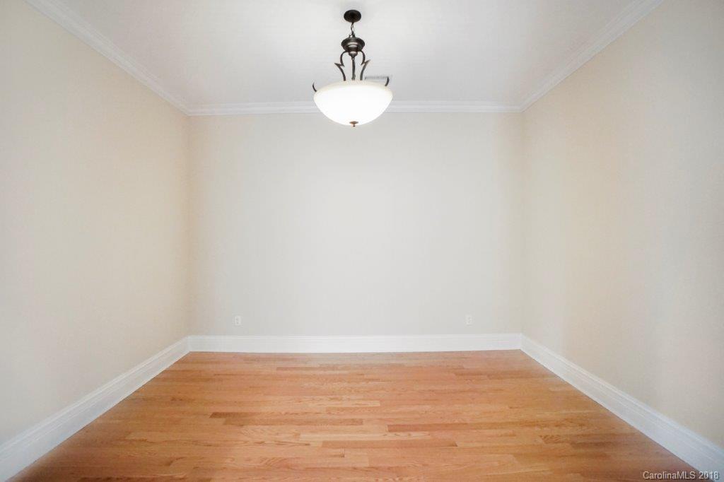 3272 Park Road Charlotte, NC 28209 - Photo 20 of 31 a view of a room with wooden floor and kitchen view