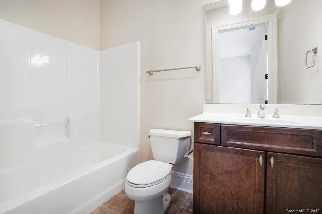 3272 Park Road Charlotte, NC 28209 - Photo 21 of 31 a bathroom with a sink toilet and shower
