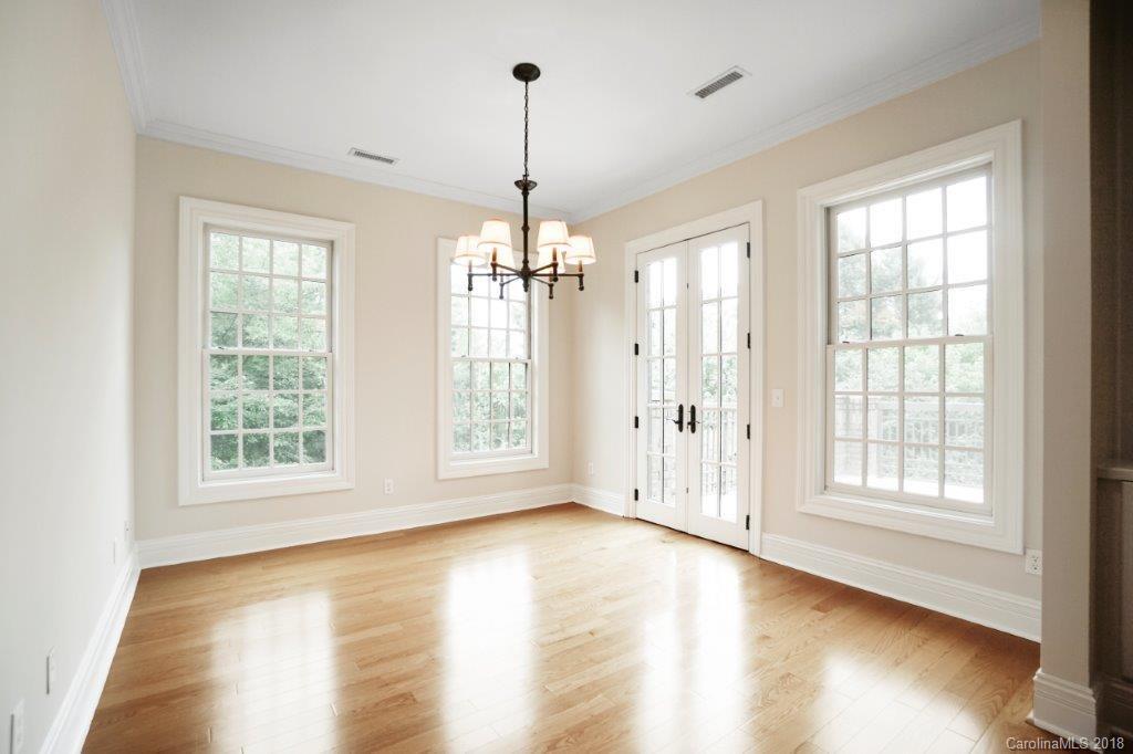 3272 Park Road Charlotte, NC 28209 - Photo 22 of 31 a view of an empty room with wooden floor and a window