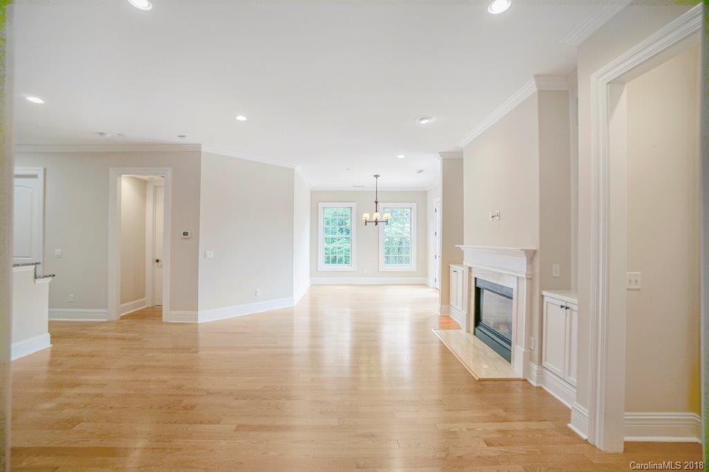 3272 Park Road Charlotte, NC 28209 - Photo 9 of 31 a view of empty room with wooden floor and fireplace