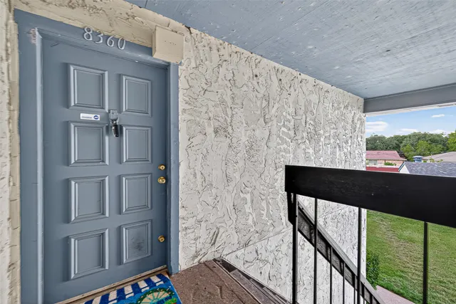 a view of balcony with wooden floor