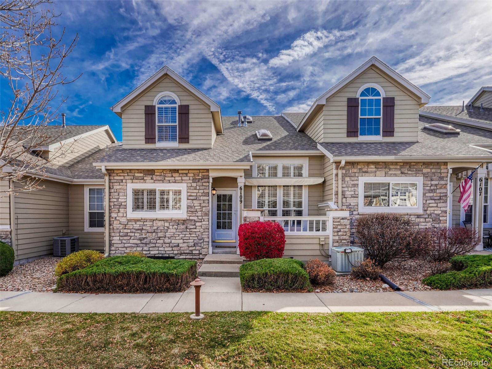 6109 Trailhead Road Highlands Ranch, CO 80130 - Photo 1 of 35 a front view of a house with garden