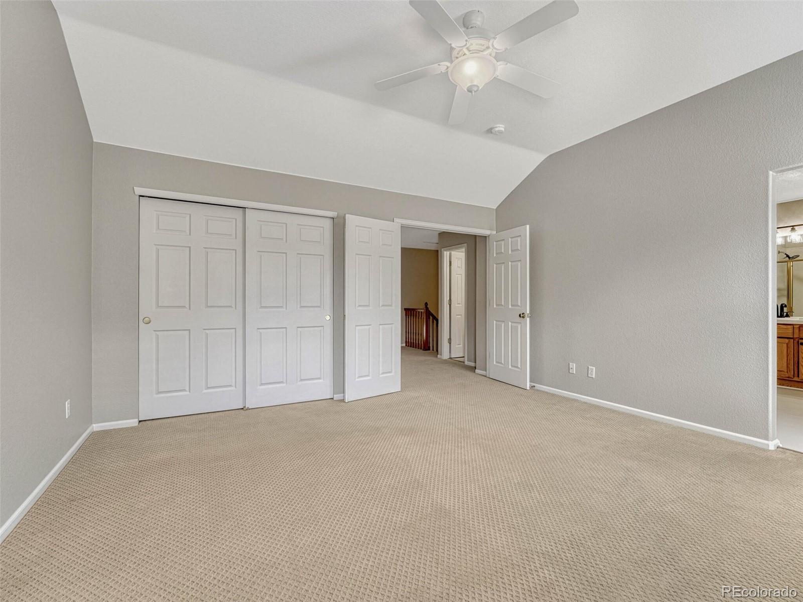 6109 Trailhead Road Highlands Ranch, CO 80130 - Photo 22 of 35 a view of an empty room with a ceiling fan