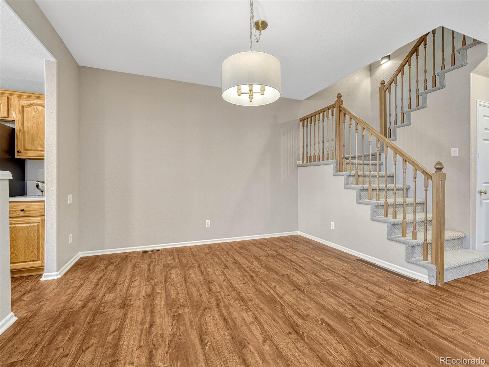 6109 Trailhead Road Highlands Ranch, CO 80130 - Photo 10 of 35 a view of entryway with wooden floor