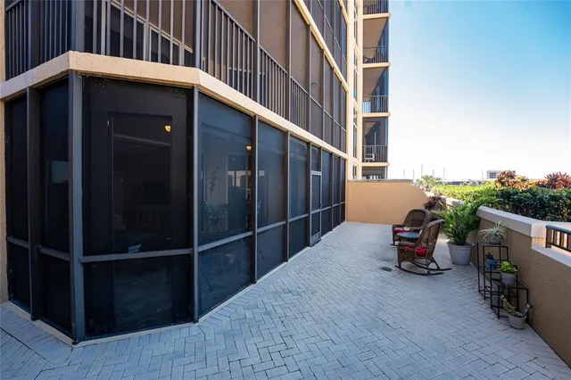 a view of a chair and table in the balcony