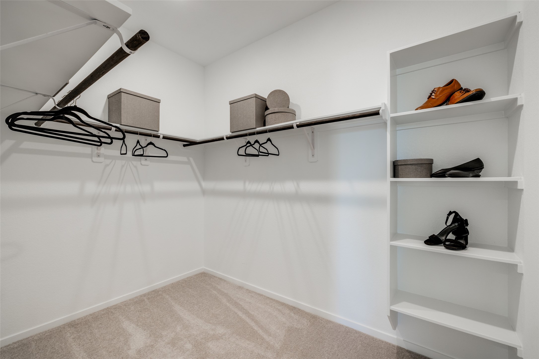 8310 Amber Summit Lane Angleton, TX 77515 - Photo 13 of 19 a view of walk in closet with clothes and shoes