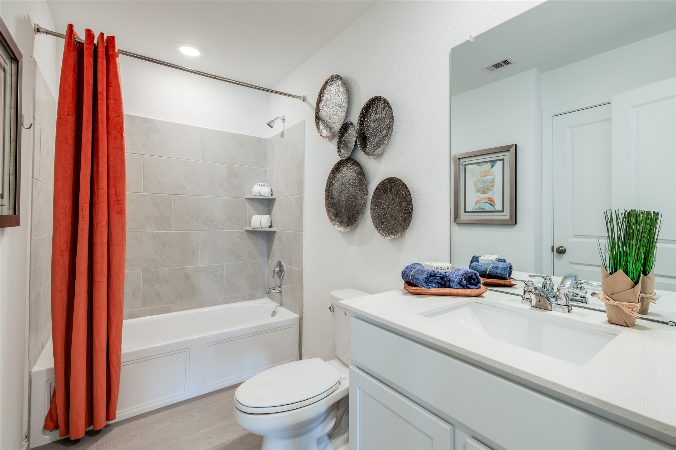 8310 Amber Summit Lane Angleton, TX 77515 - Photo 18 of 19 a bathroom with a sink a toilet and a mirror