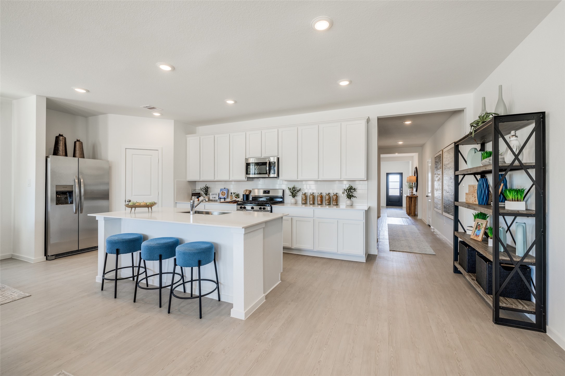 8310 Amber Summit Lane Angleton, TX 77515 - Photo 2 of 19 a kitchen with white cabinets and refrigerator