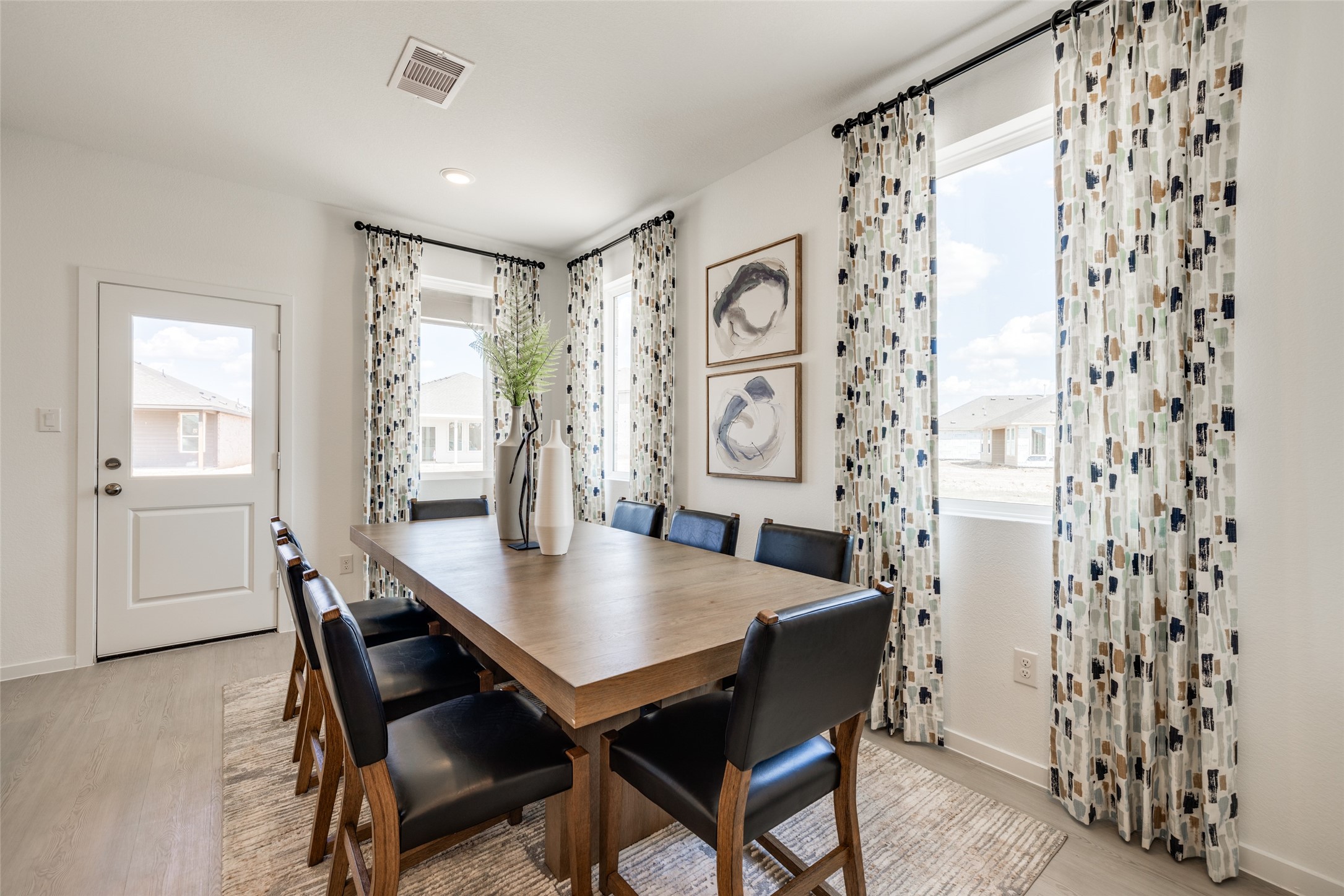 8310 Amber Summit Lane Angleton, TX 77515 - Photo 8 of 19 a view of a dining room with furniture and window