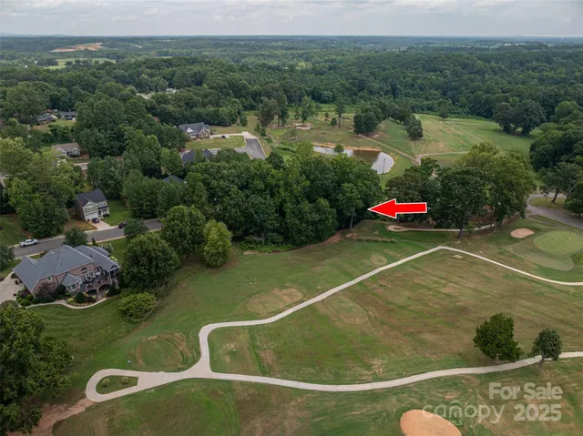 a view of a water with a table and chairs